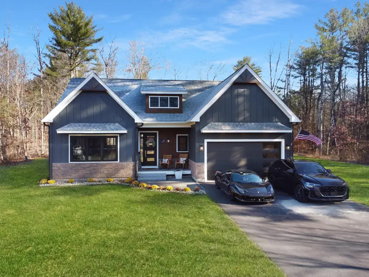 Newly built craftsman-style single-family home with a two-car garage on a landscaped lot at Owl's Nest Resort