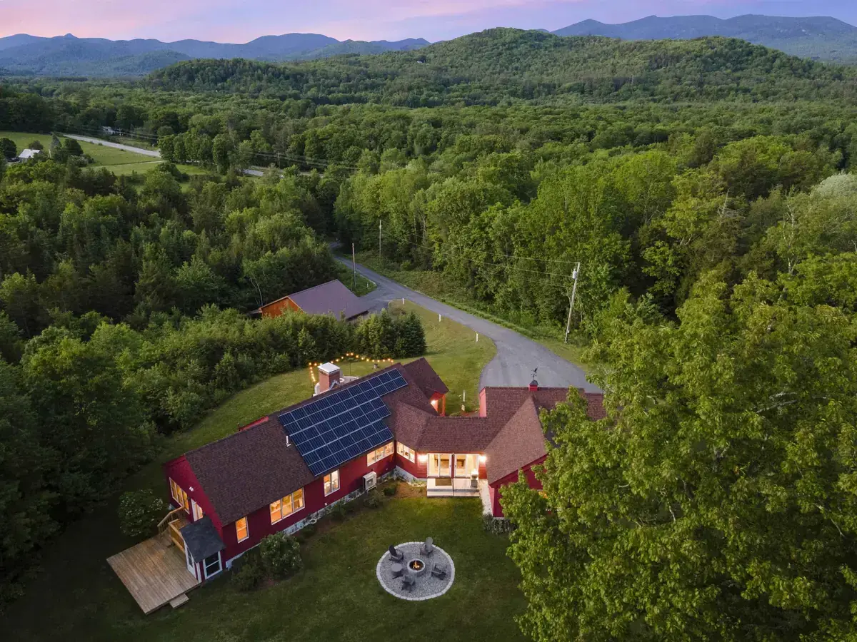 Aerial view of a managed vacation home in the mountains at dusk