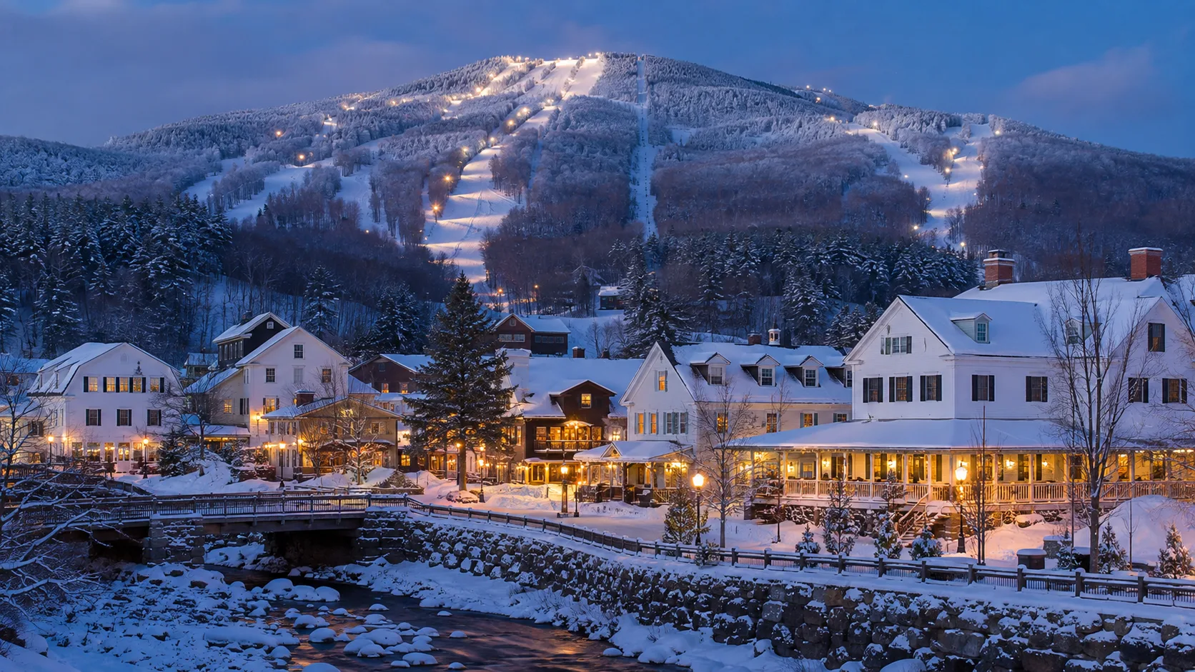 Snow-covered ski town village in the White Mountains of New England at dusk